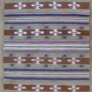 A Wide Ruin Navajo Rug by Bessie George