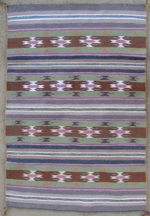 A Wide Ruin Navajo Rug by Bessie George